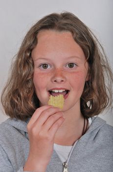 Girl eating chip