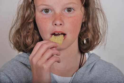 Girl eating chip