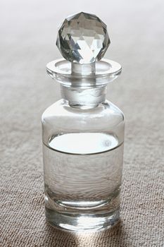 Clear spa oil in luxury glass bottle