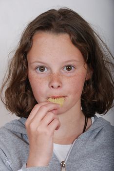 Girl eating chip