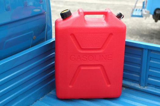 Red Gasoline refill tank on mini  pickup truck 