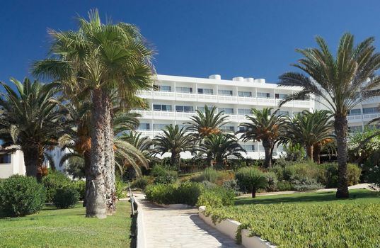 Hotel and the garden around it on a clear sunny day in Cyprus