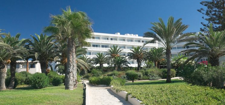 hotel and the garden around it on a clear sunny day in Cyprus