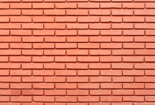 Red painted brick wall outside the building