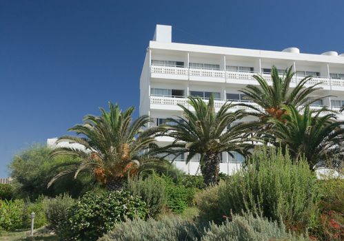 hotel and the garden around it on a clear sunny day in Cyprus