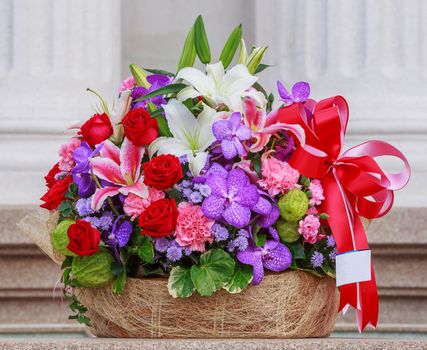 Basket of flowers with namecard tag