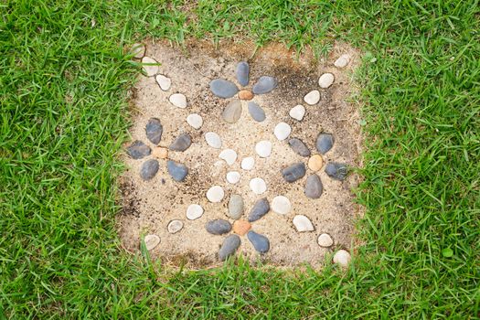 Stone decoration with concrete block on lawn