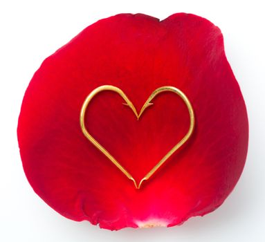 Red rose petal and hook arrange as heart symbol