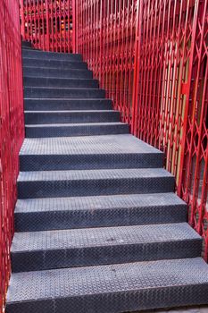 Black iron sheet staircase and red iron fence 