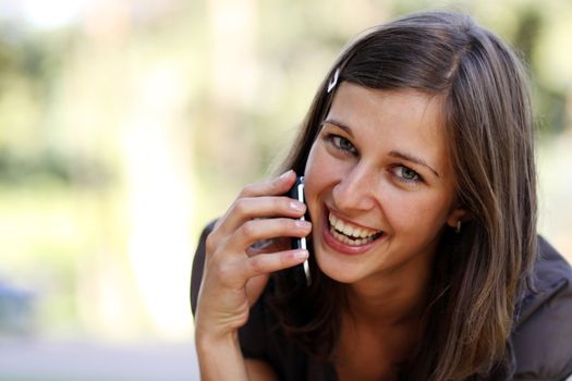 Young woman calling by phone