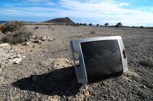 A Broken Gray Television Abandoned in the Desert