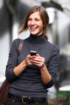 Young beautiful woman talking on cell phone