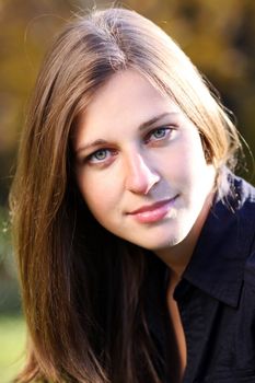 Beautiful young woman in autumn park