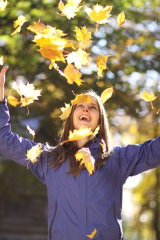 Beautiful young woman in autumn park