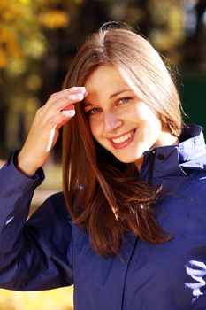 Beautiful young woman in autumn park