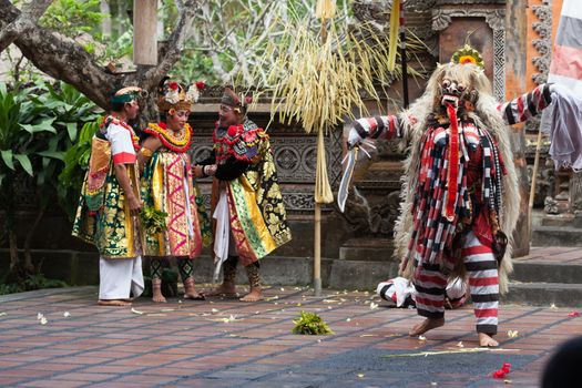 BALI - SEP 21: Rangda in Barong and Kris Dance performs at Sahadewah, in Batubulan, Bali, Indonesia on Sep 21, 2012. This famous play represents an fight between good and bad gods.