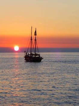 Boat going towards the sunset in the Adriatic Sea near Rovinj