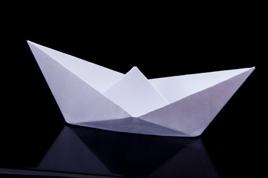 An image of white origami boat 
