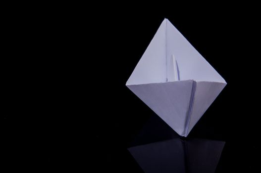 An image of white origami boat 