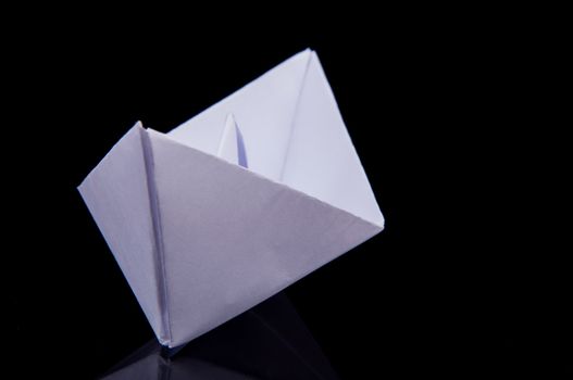 An image of white origami boat 