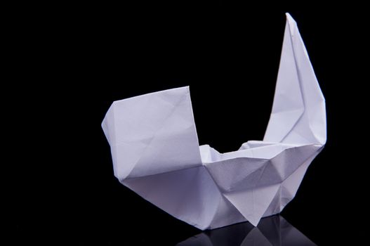 An image of white origami boat 