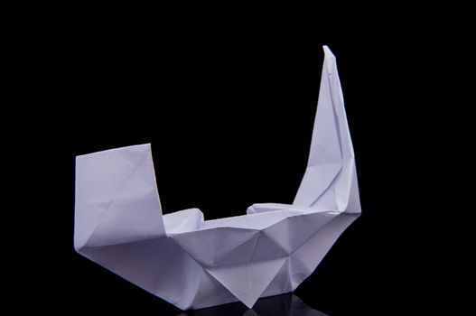 An image of white origami boat 