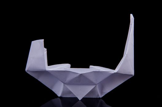 An image of white origami boat 