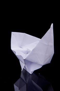 An image of white origami boat 