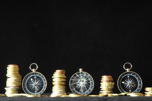 Orientation in  Business Compass and Money on a Black Background