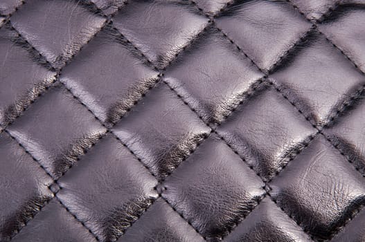 An image of squared black leather background