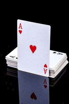 An image of playing cards, dice and money