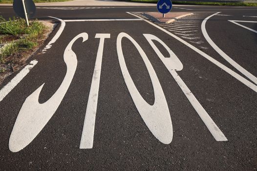 Stop sign painted on the road