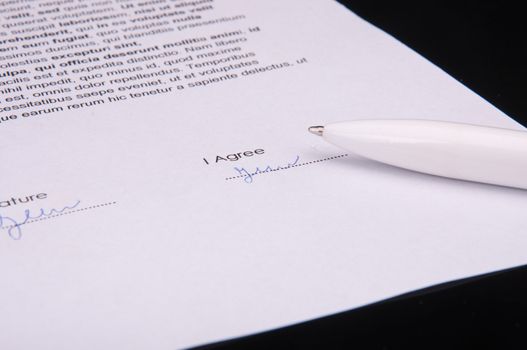 An image of signature over agreement