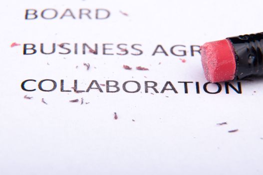 An image of business words and pencil