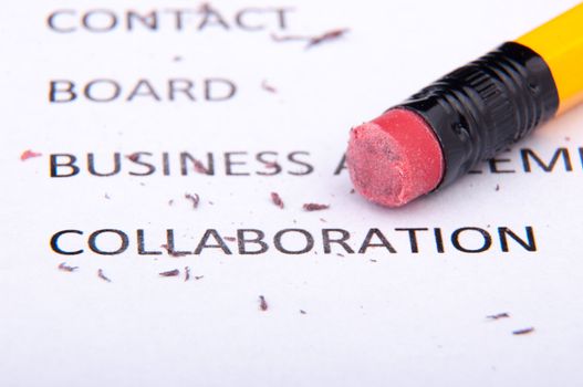 An image of business words and pencil