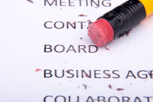 An image of business words and pencil
