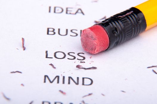 An image of business words and pencil