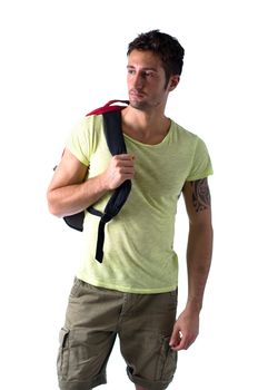 Attractive young man with backpack, isolated on white background, looking to a side