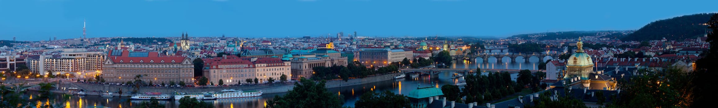 Panoramic view on bridges over the Vltava River in Prague at night