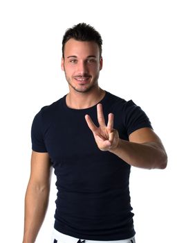 Attractive young man counting to three with fingers and hands, isolated on white background