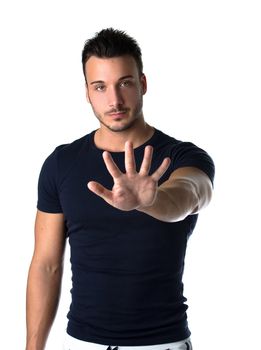 Attractive young man counting to five with fingers and hands, isolated on white background