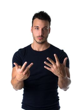 Attractive young man counting to eight with fingers and hands, isolated on white background