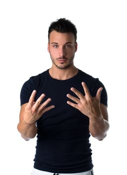 Attractive young man counting to nine with fingers and hands, isolated on white background