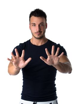 Attractive young man counting to ten with fingers and hands, isolated on white background