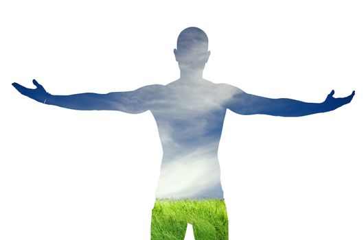 Inverse silhouette of man with arms spread open on green grass and blue sky