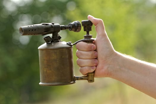 close-up of a antique gasoline welder from second worl war