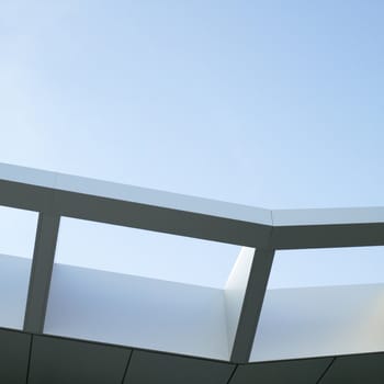 Modern architectural building awning against blue sky