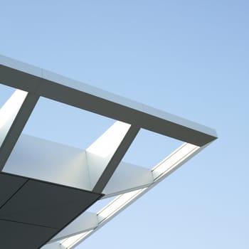 Modern architectural building awning against blue sky