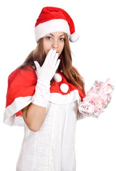 Beautiful christmas woman in santa hat holding gift isolated