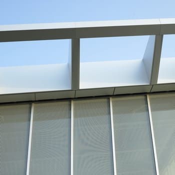 Modern architectural building awning against blue sky